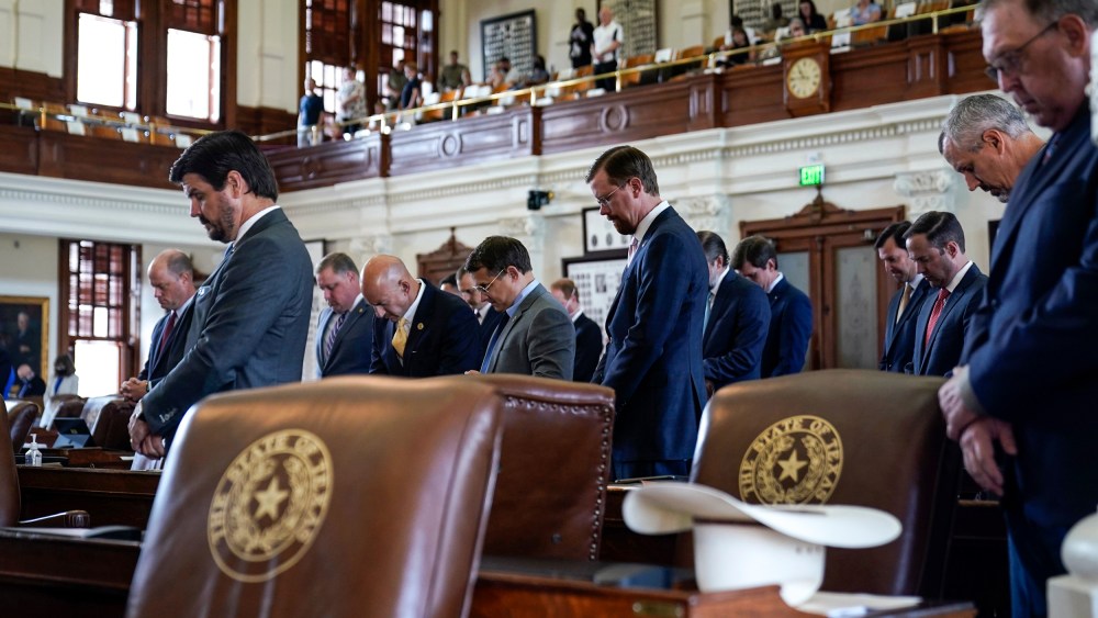 Image: Texas State Representatives pray in the House Chamber at the Texas Capitol as they prepare to debate voting bill SB1 on Aug. 26, 2021, in Austin, Texas.