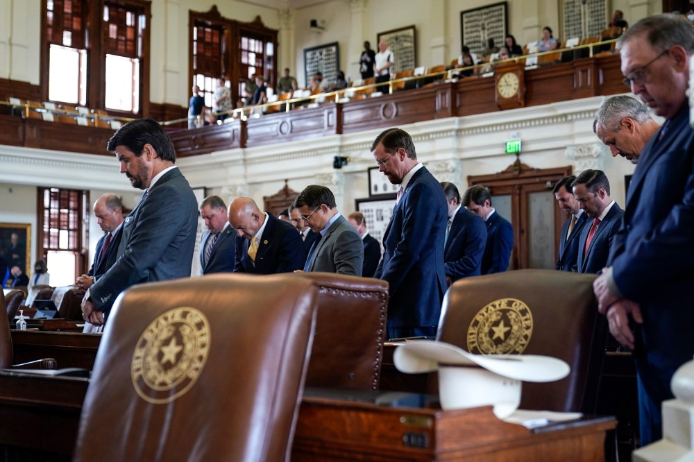 Image: Texas State Representatives pray in the House Chamber at the Texas Capitol as they prepare to debate voting bill SB1 on Aug. 26, 2021, in Austin, Texas.