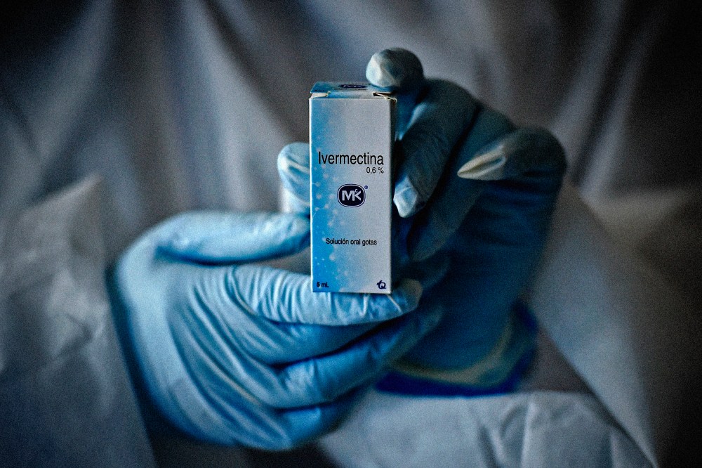 Image: A health worker holds a bottle of Ivermectin in Cali, Colombia, on July 21, 2020.