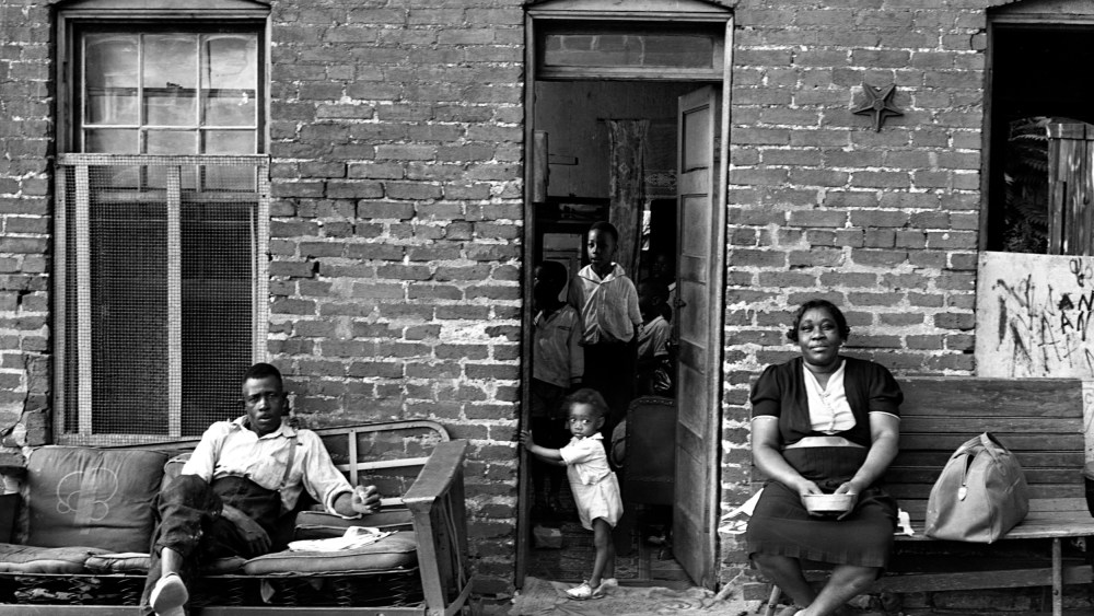 Image: A Black family at their home in Washington, D.C., in 1937.
