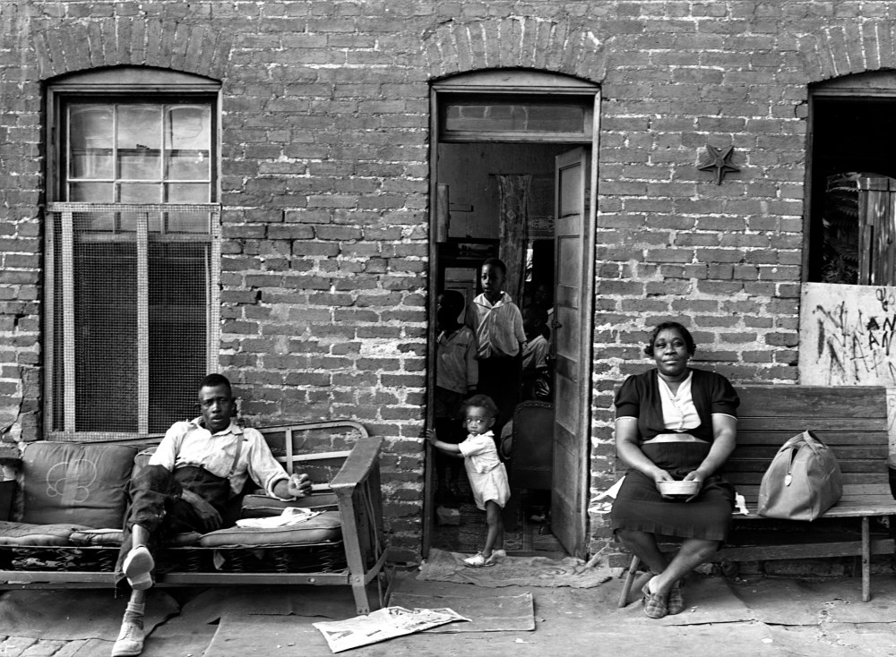Image: A Black family at their home in Washington, D.C., in 1937.