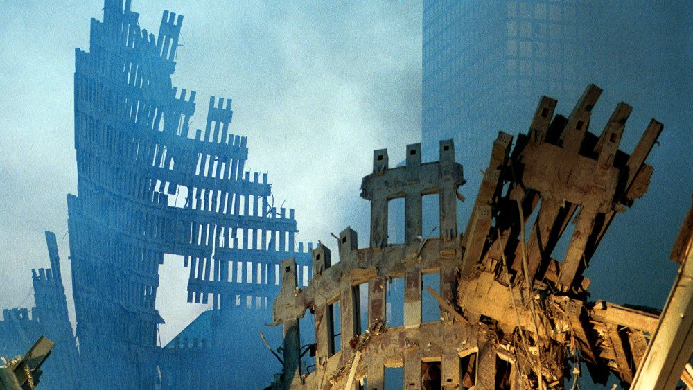 Image: Early morning light in the smoke and wreckage at the World Trade Center on Sept. 13, 2001.