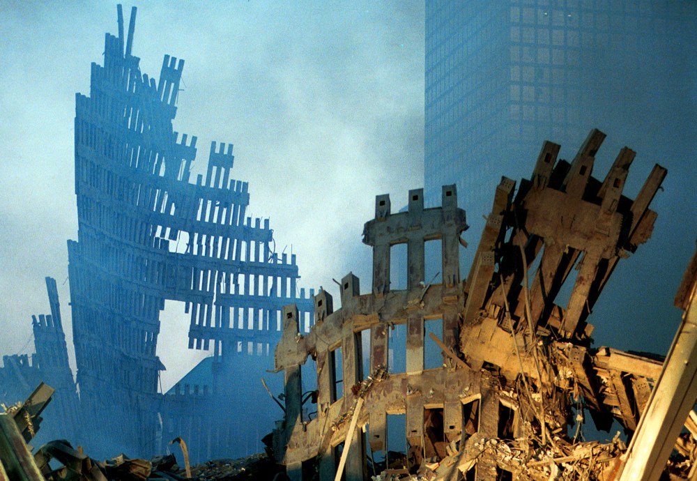Image: Early morning light in the smoke and wreckage at the World Trade Center on Sept. 13, 2001.