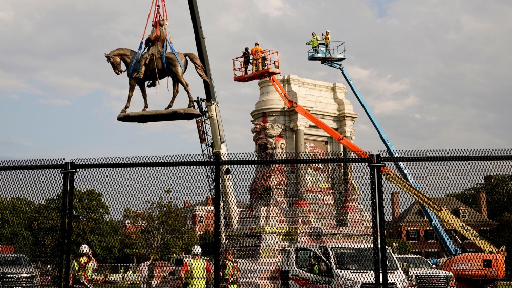 Image: Crews remove a statue of Confederate General Robert E. Lee in Richmond, Va., on Sept. 8, 2021.