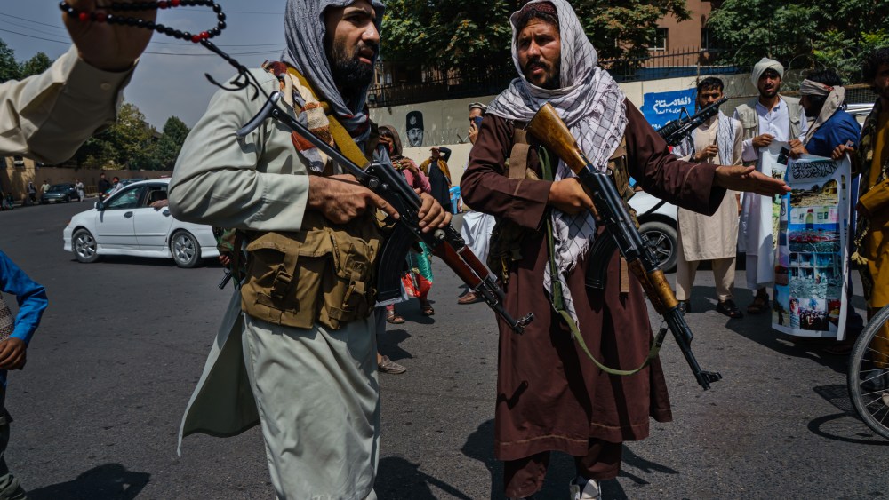 Image: Taliban fighters mobilize to control a crowd in Kabul, Afghanistan, on Aug. 19, 2021.