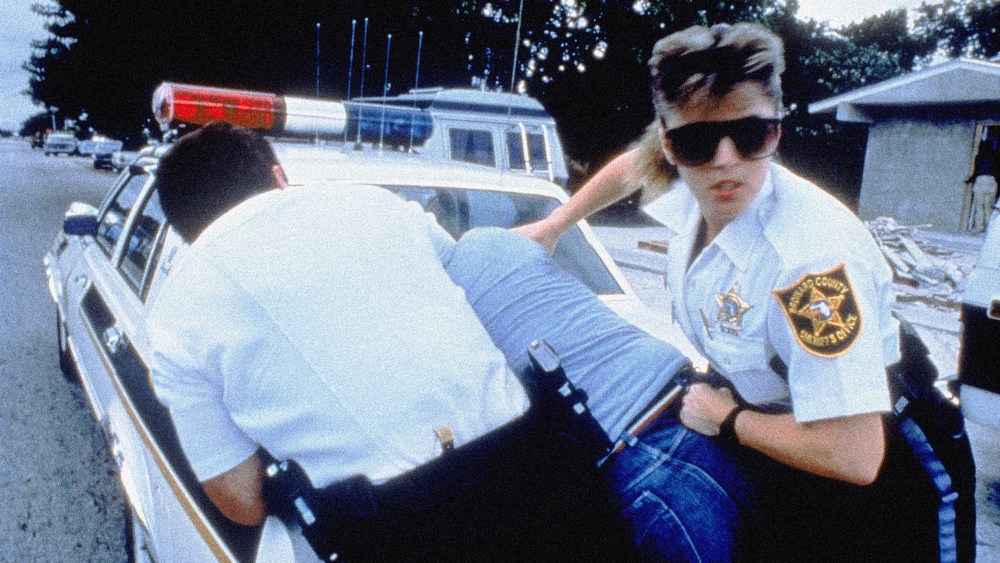 Image: Police officers in Broward County, Fla., restrain a suspect in a 1989 episode of "COPS."