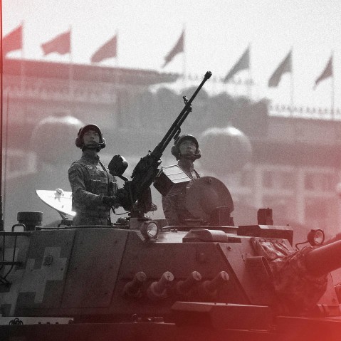 Image: Tank crew members stand at attention during a parade commemorating the 70th anniversary of Communist China in Beijing in 2019.