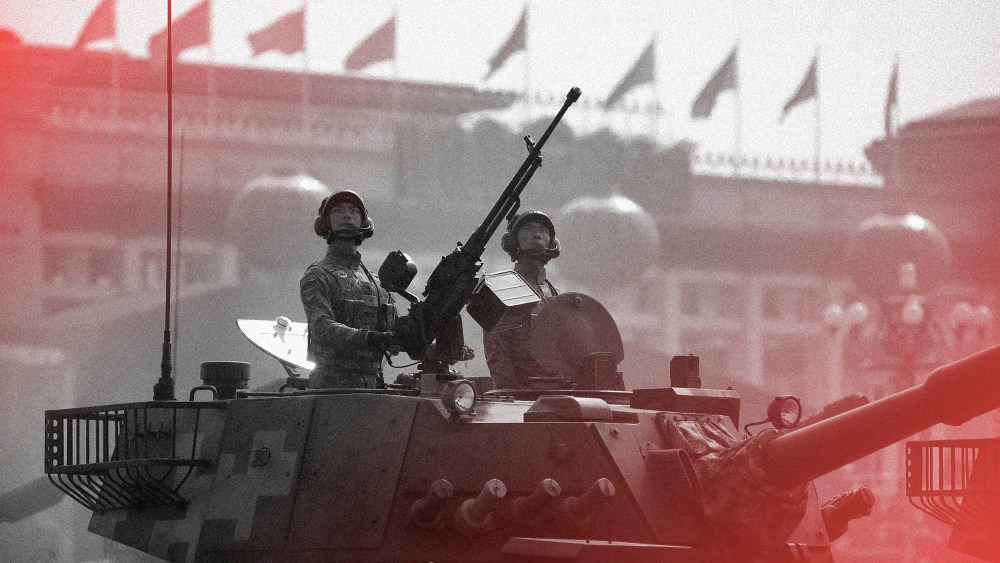 Image: Tank crew members stand at attention during a parade commemorating the 70th anniversary of Communist China in Beijing in 2019.