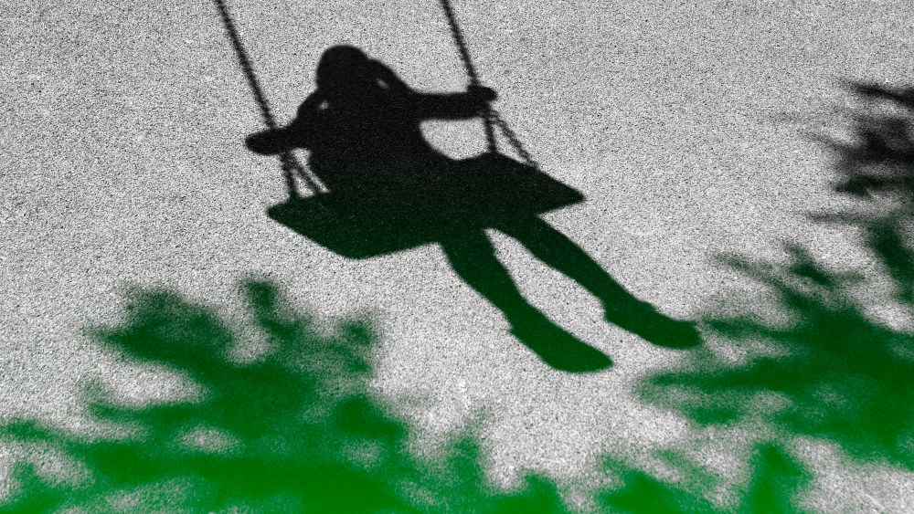IMage: Girl on a swing shadow