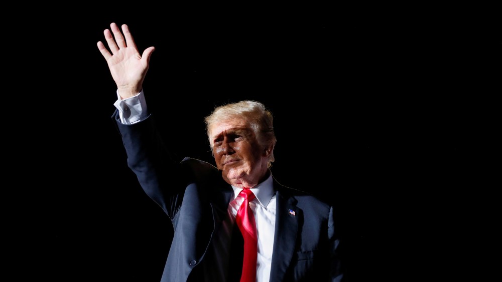 Former President Donald Trump waves after his speech during a rally at the Iowa States Fairgrounds in Des Moines on Oct. 9, 2021.
