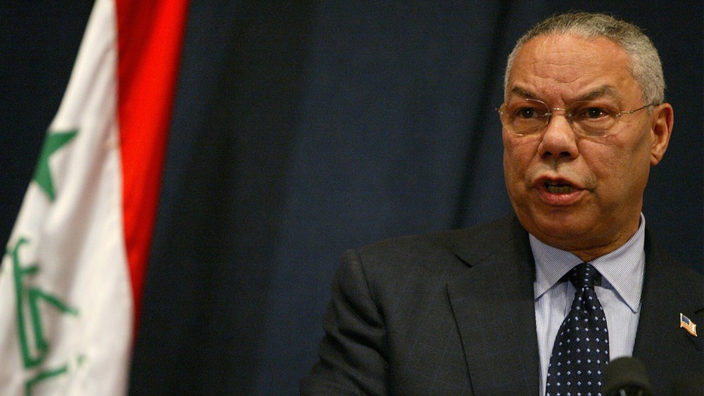 Image: Colin Powell speaking at a press conference in Baghdad.
