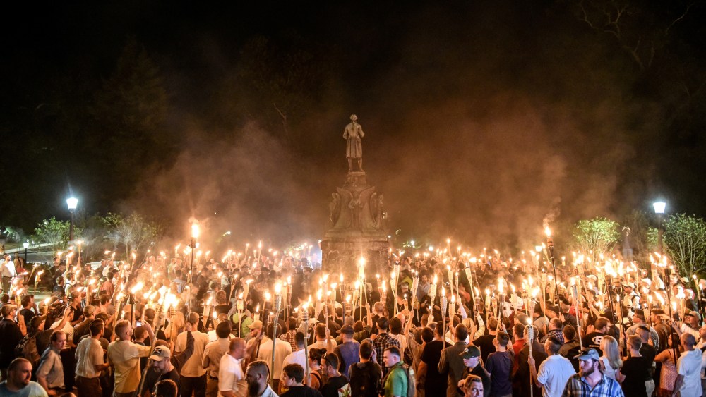White nationalists march on the grounds of the University of Virginia ahead of the "Unite the Right Rally" in Charlottesville on Aug. 11, 2017.