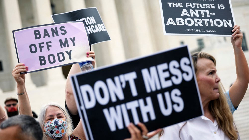 Abortion rights and anti-abortion activists protest alongside each other outside of the Supreme Court on Oct. 4, 2021, in Washington.