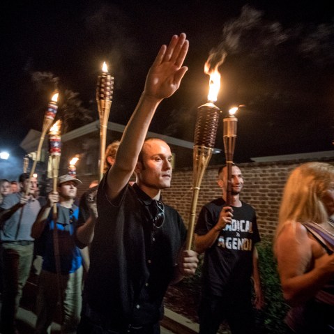 Image: White nationalists and white supremacists march through the University of Virginia campus in Charlottesville on Aug. 11, 2017.