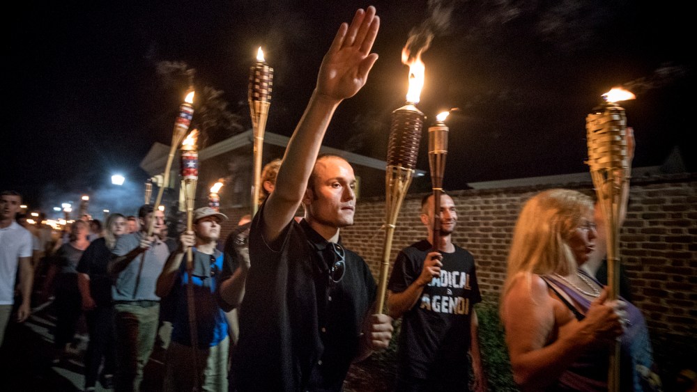 Image: White nationalists and white supremacists march through the University of Virginia campus in Charlottesville on Aug. 11, 2017.