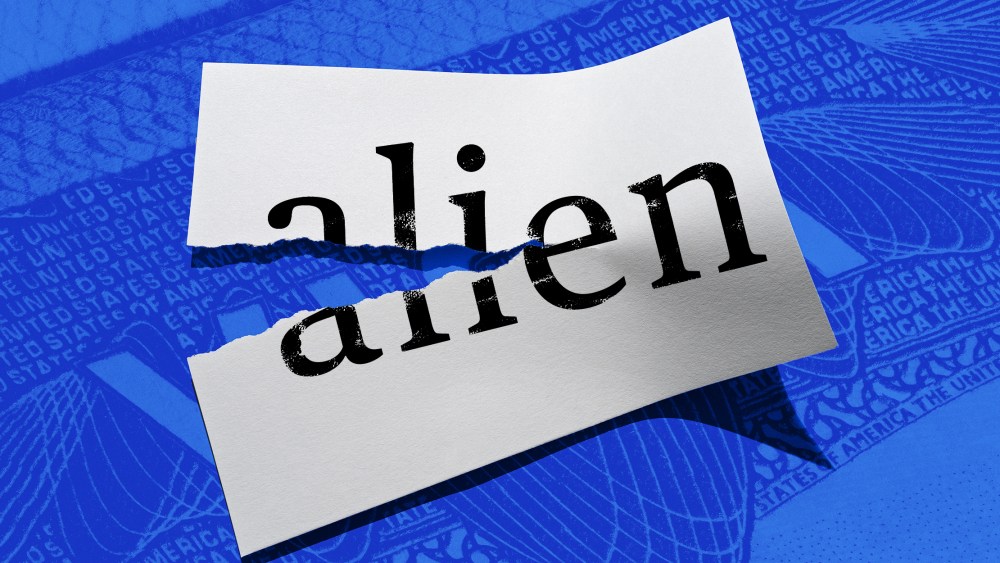 Photo illustration: A half ripped paper with the word "alien" on it.