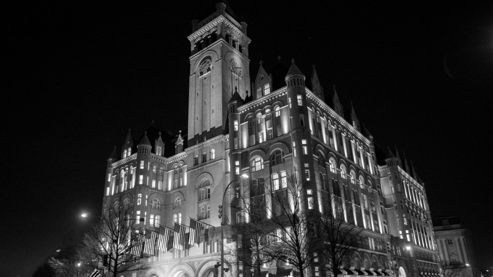 Image: View of the Trump International Hotel at night.