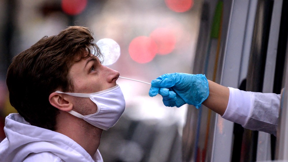 Image: A person receives a nasal swab during a test for Covid-19.