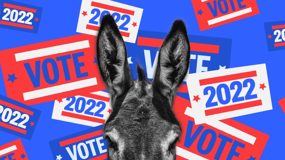 Photo illustration: Top half of a donkey's head shown against flying stickers in red, blue and white colors that read,"Vote" and "2022".
