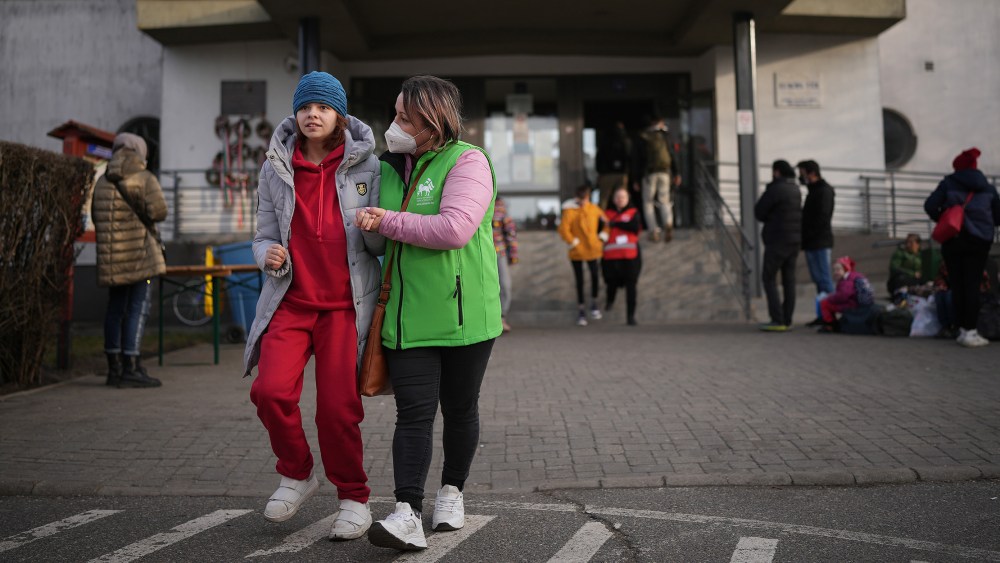 Image: Ukrainian refugees with disabilities are helped by their carers at the Hungarian border town of Zahony on March 2, 2022.