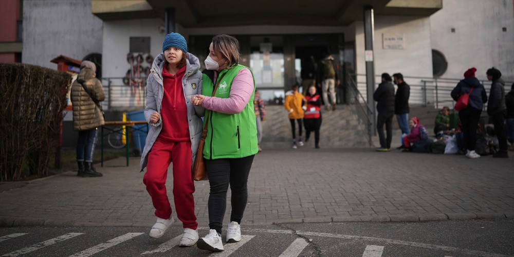 Image: Ukrainian refugees with disabilities are helped by their carers at the Hungarian border town of Zahony on March 2, 2022.