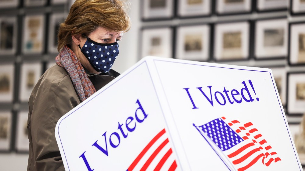 A woman casts her vote