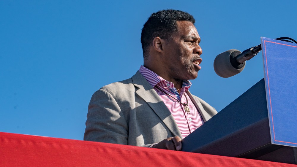 Image: Herschel Walker speaking on stage.