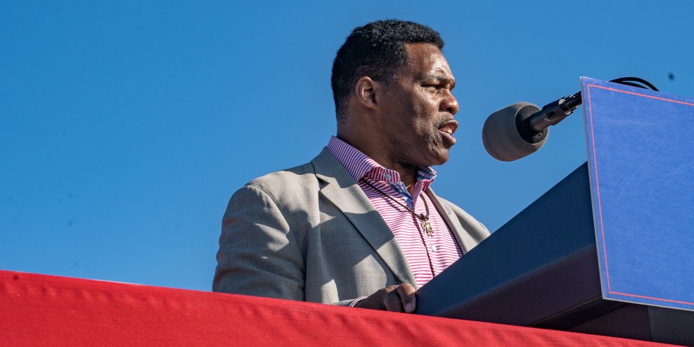 Image: Herschel Walker speaking on stage.