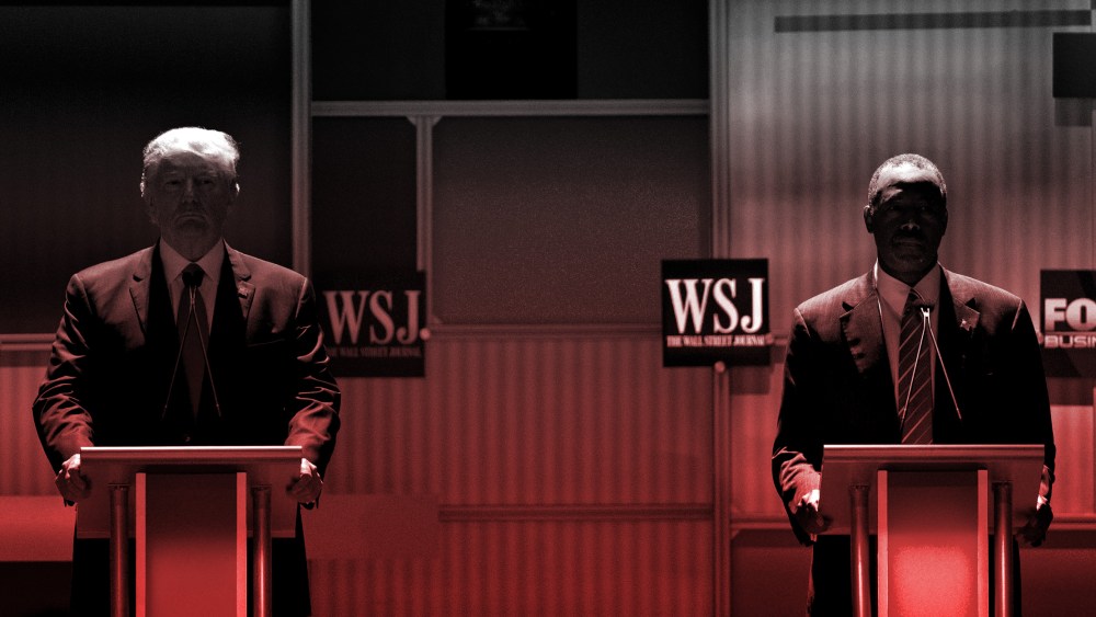 Photo illustration: Red color cast over an image of 2016 Republican presidential candidates Donald Trump and Ben Carson, standing in shadow at their podiums during a presidential candidate debate.