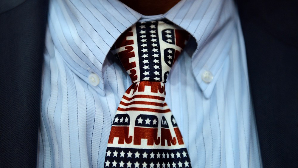Image: A close-up of a tie decorated with  with elephants, the Republican party mascots.