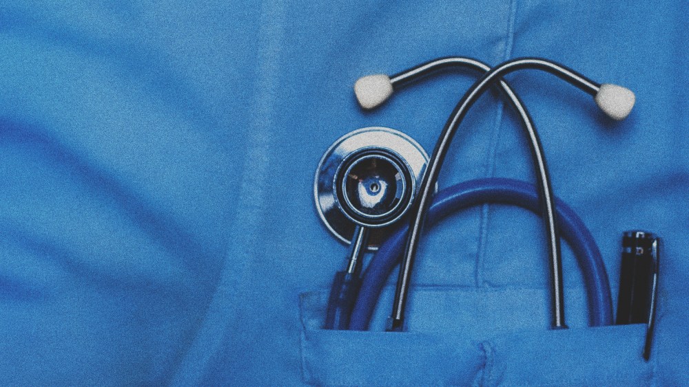 Image: A doctors scrubs with a stethoscope in the pocket.