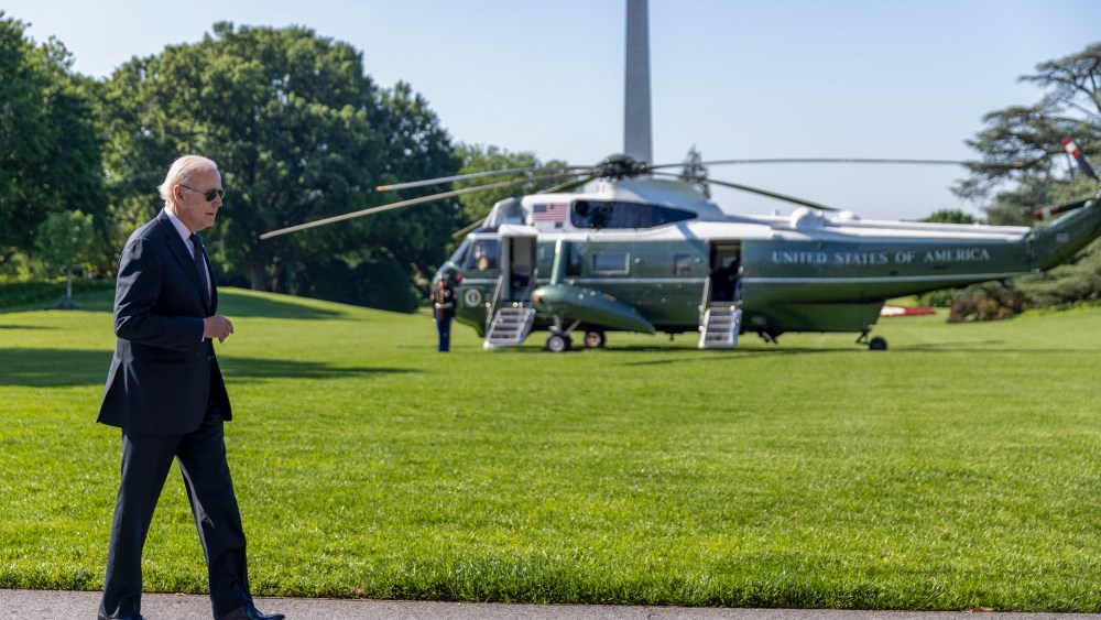 Image: Joe Biden walking on the white house lawn.