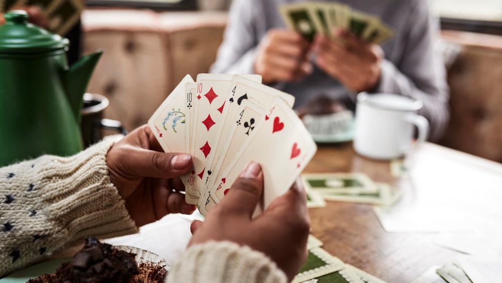 Friends playing cards in camper van