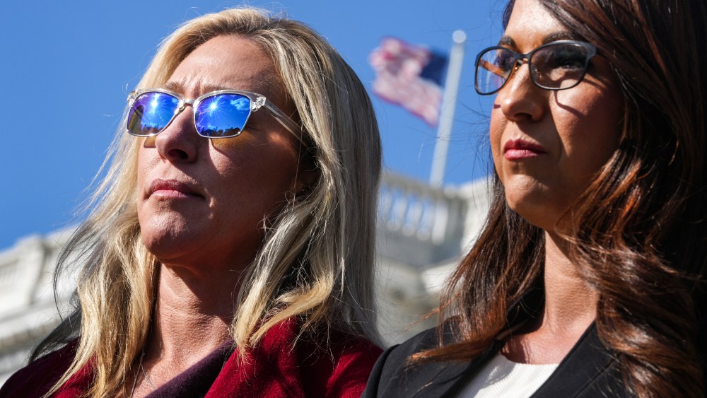Reps. Marjorie Taylor Greene, R-Ga., left, and Lauren Boebert, R-Colo., attend a news conference outside the Capitol on Nov. 3, 2021.