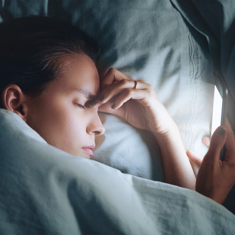 Close-Up Of Woman Sleeping On Bed At Home