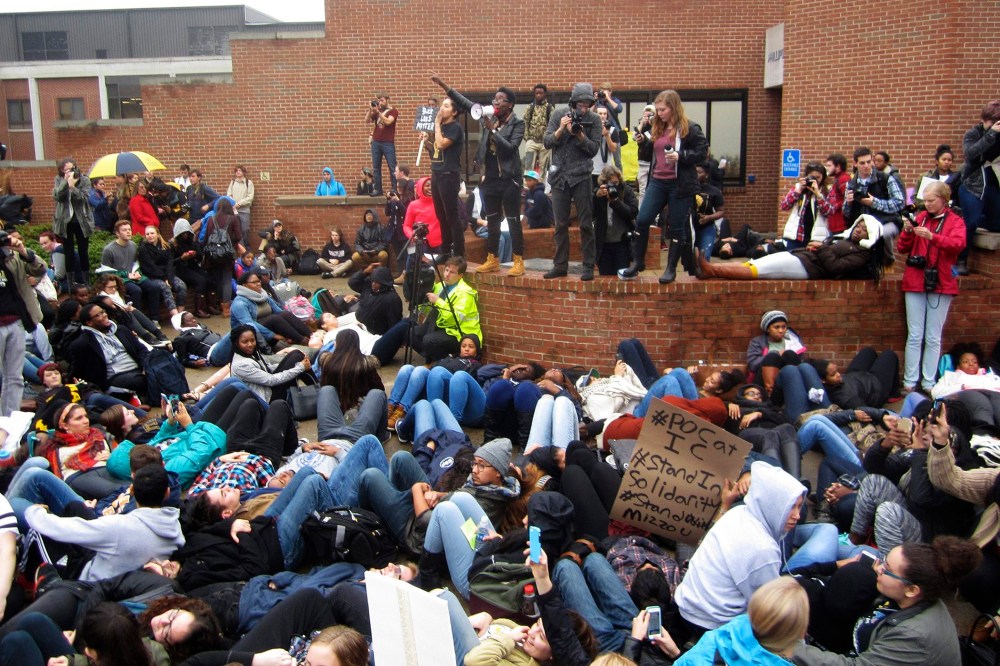 Protestors encourage students to lay down as part of a 'die-in' at Ithaca College in Ithaca, New York, Nov. 11, 2015. (Photo by Matthew Liptak/Reuters)