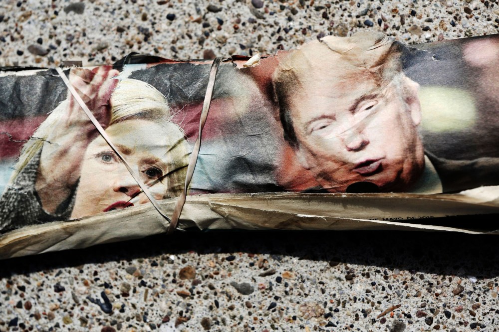A rubber band wraps the front page of the La Opinion newspaper on a sidewalk in Santa Ana, Calif., May 15, 2016. (Photo by Patrick T. Fallon/Reuters)