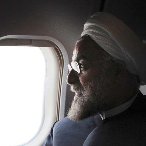 In this Monday, June 10, 2013, Iranian President, Hasan Rouhani, a former Iran's top nuclear negotiator, looks on, in his plane, during his presidential election campaign tour to the northwestern, Iran.  (Photo by Vahid Salemi/AP)