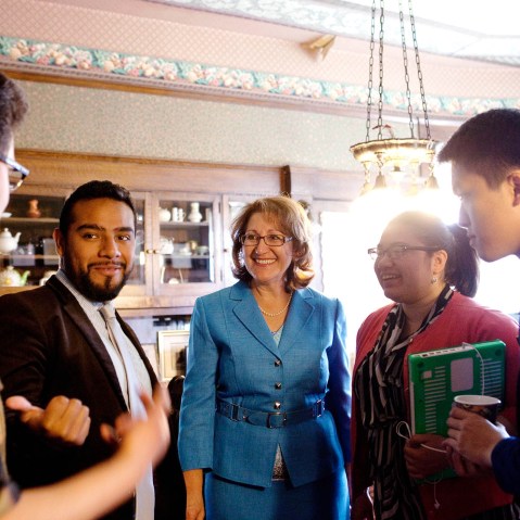 Eloise Gomez Reyes (center) talks to campaign volunteers at her law office, which is currently acting as her campaign headquarters, in Colton, CA on Feb. 11, 2014.