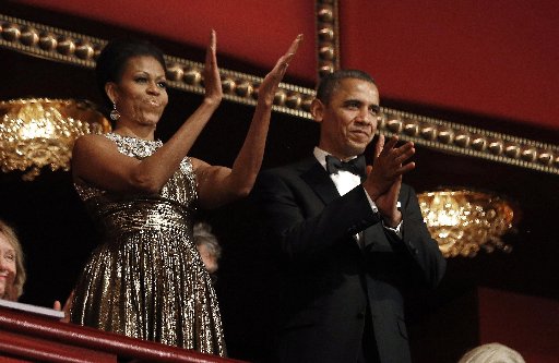 U.S. President Barack Obama and first lady Michelle Obama applaud on the balcony as they attend the 2012 Kennedy Center Honors at the Kennedy Center in Washington, December 2, 2012. (Photo: Reuters/Jason Reed)