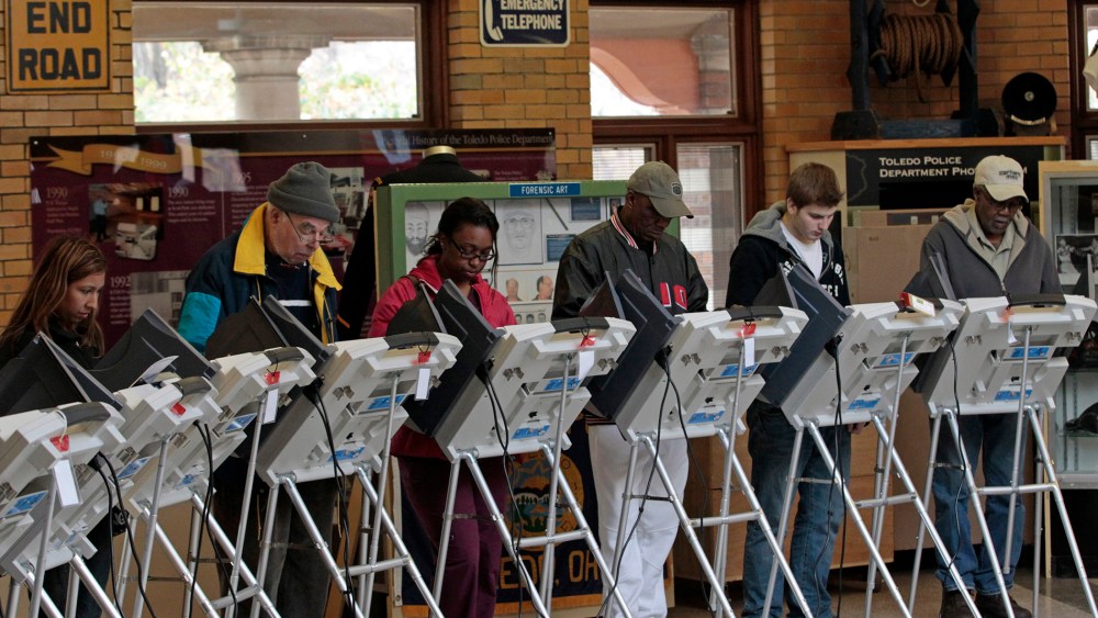 People vote at a polling site at the Toledo Police Museum for the 2012 presidential election in Toledo, Ohio, November 6, 2012.