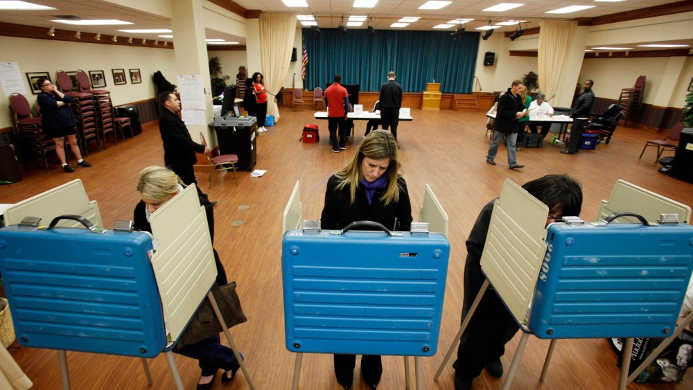 Voters cast their ballots at a polling site in the 2012 US presidential election in Cleveland, Ohio, November 6, 2012.