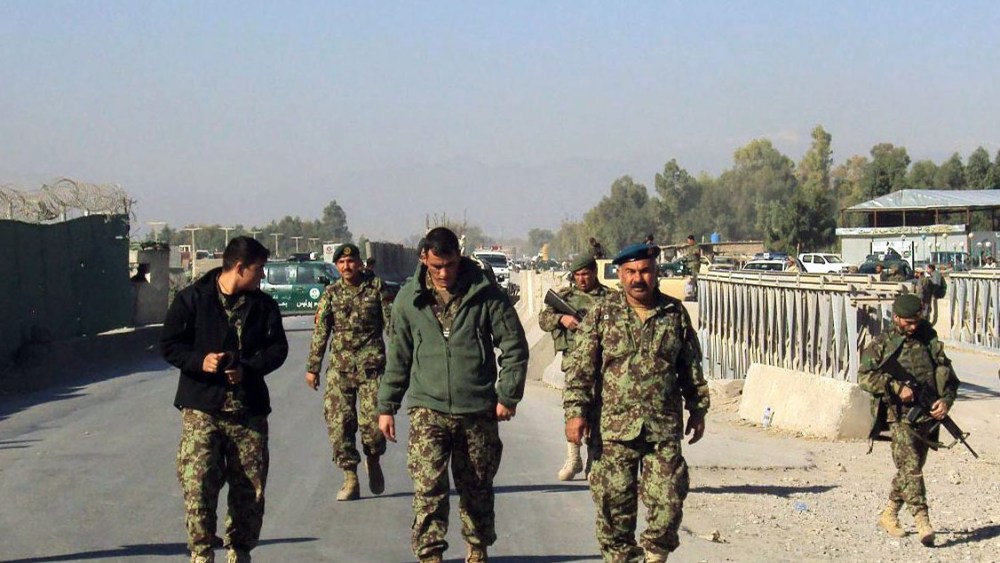Afghan National Army soldiers stand guard outside the US military base after a fierce gun battle between Taliban militants and Afghan security forces, in Jalalabad, Afghanistan, 02 December 2012.  (Photo by Abdul Mieed/EPA)