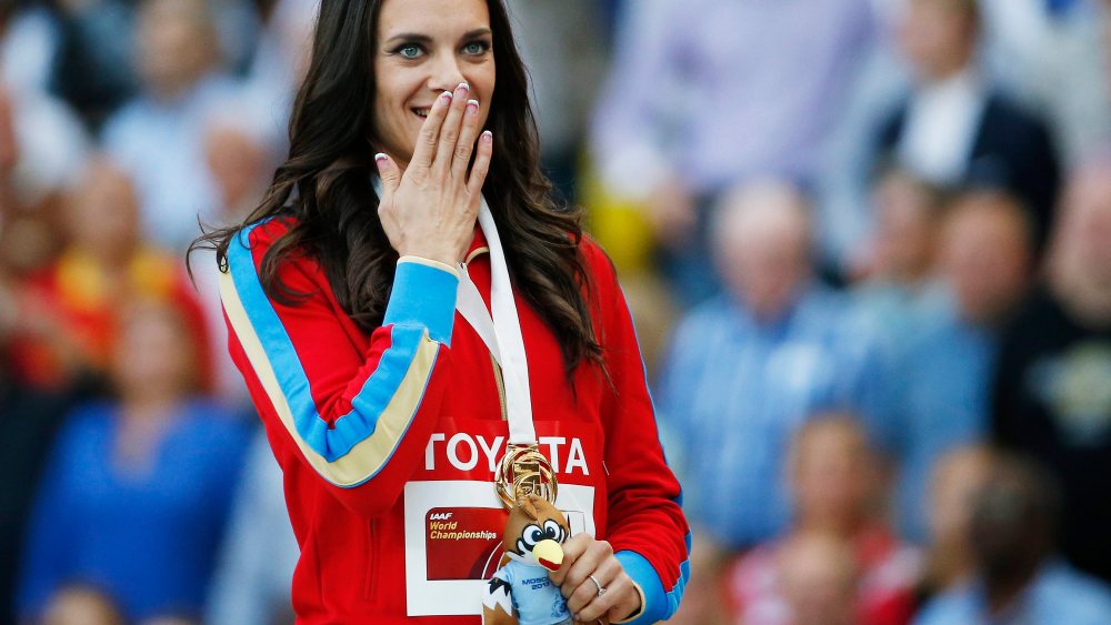 Gold medalist Yelena Isinbayeva of Russia during the medal ceremony for the women's Pole Vault at the 14th IAAF World Championships at Luzhniki stadium in Moscow, Russia, 15 August 2013. (Photo by Kerim Okten/EPA)