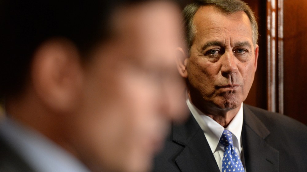 House Speaker Republican John Boehner listens to House Majority Leader Republican Eric Cantor at a news conference with other House Republicans following a Republican caucus meeting on Capitol Hill in Washington D.C., October 23, 2013.