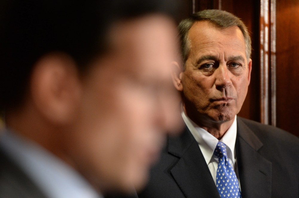 House Speaker Republican John Boehner listens to House Majority Leader Republican Eric Cantor at a news conference with other House Republicans following a Republican caucus meeting on Capitol Hill in Washington D.C., October 23, 2013.
