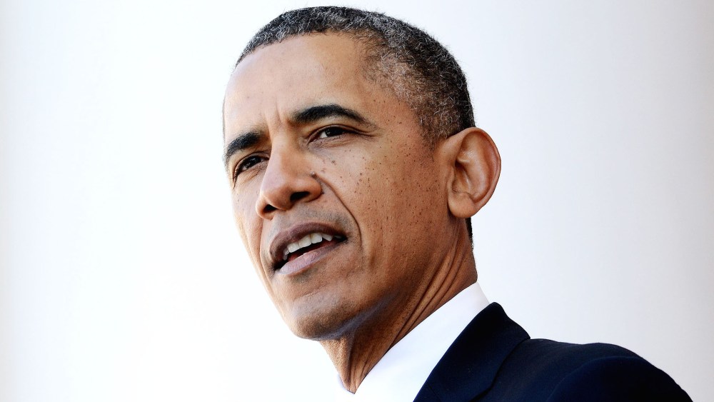 US President Barack Obama speaks during a ceremony to honor veterans at the Tomb of the Unknowns at Arlington National Cemetery, November 11, 2013.