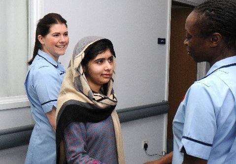 This photo made available by Queen Elizabeth Hospital, Birmingham, England shows Malala Yousufzai saying goodbye as she is discharged from the hospital to continue her rehabilitation at her family’s temporary home in the area, Friday, Jan. 4, 2013. the...