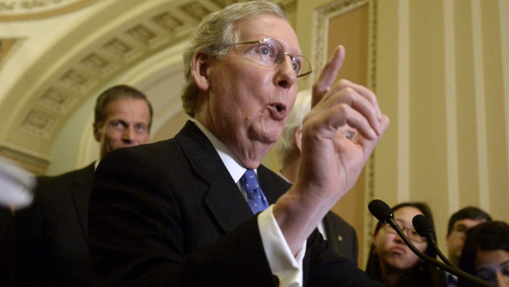 Senate Minority Leader Republican Mitch McConnell responds to a question on Capitol Hill in Washington D.C., March 25, 2014.