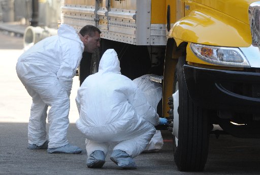 BOSTON, MA - APRIL 17: FBI crime scene investigators search a truck left on Boylston Street just past Berkeley Street April 17, 2013 in Boston, Massachusetts. Investigators continue to work the scene of two bomb explosions at the finish line of the...